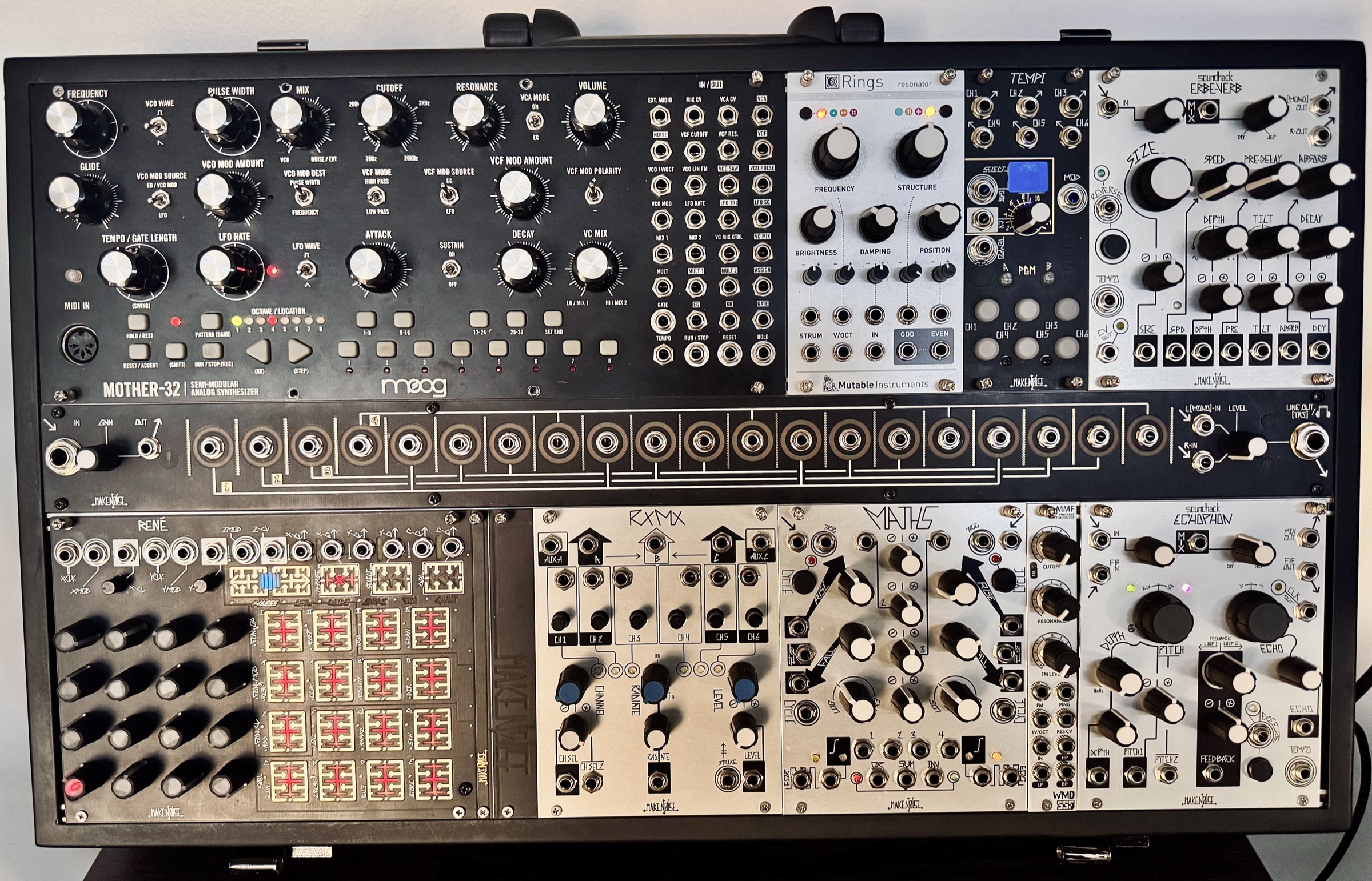 A modular synthesizer rack with Moog and Make Noise modules used in the original recording of An Agreement.